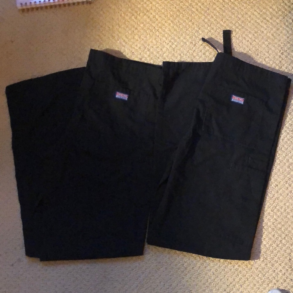 A pair of 2 Cherokee workwear black scrub pants